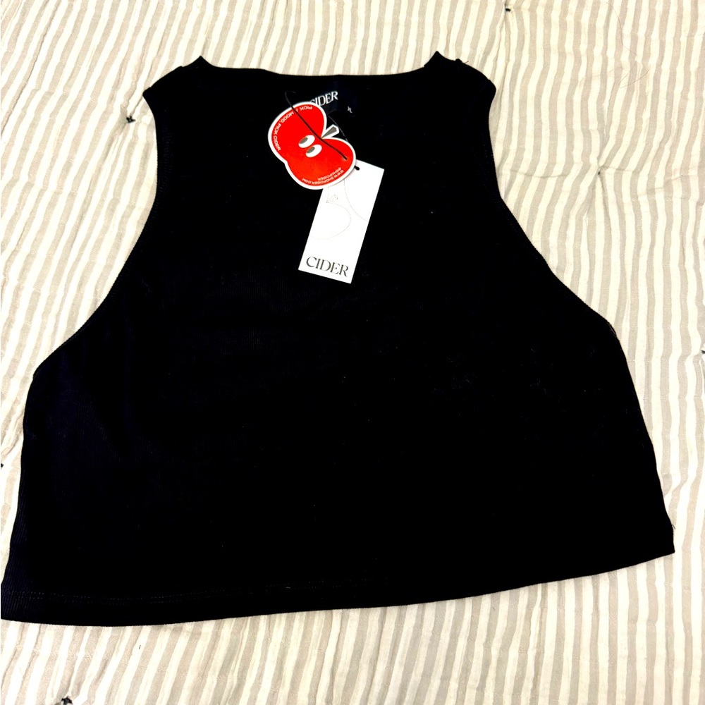 Black crop top with side ruching for a super cute fit.